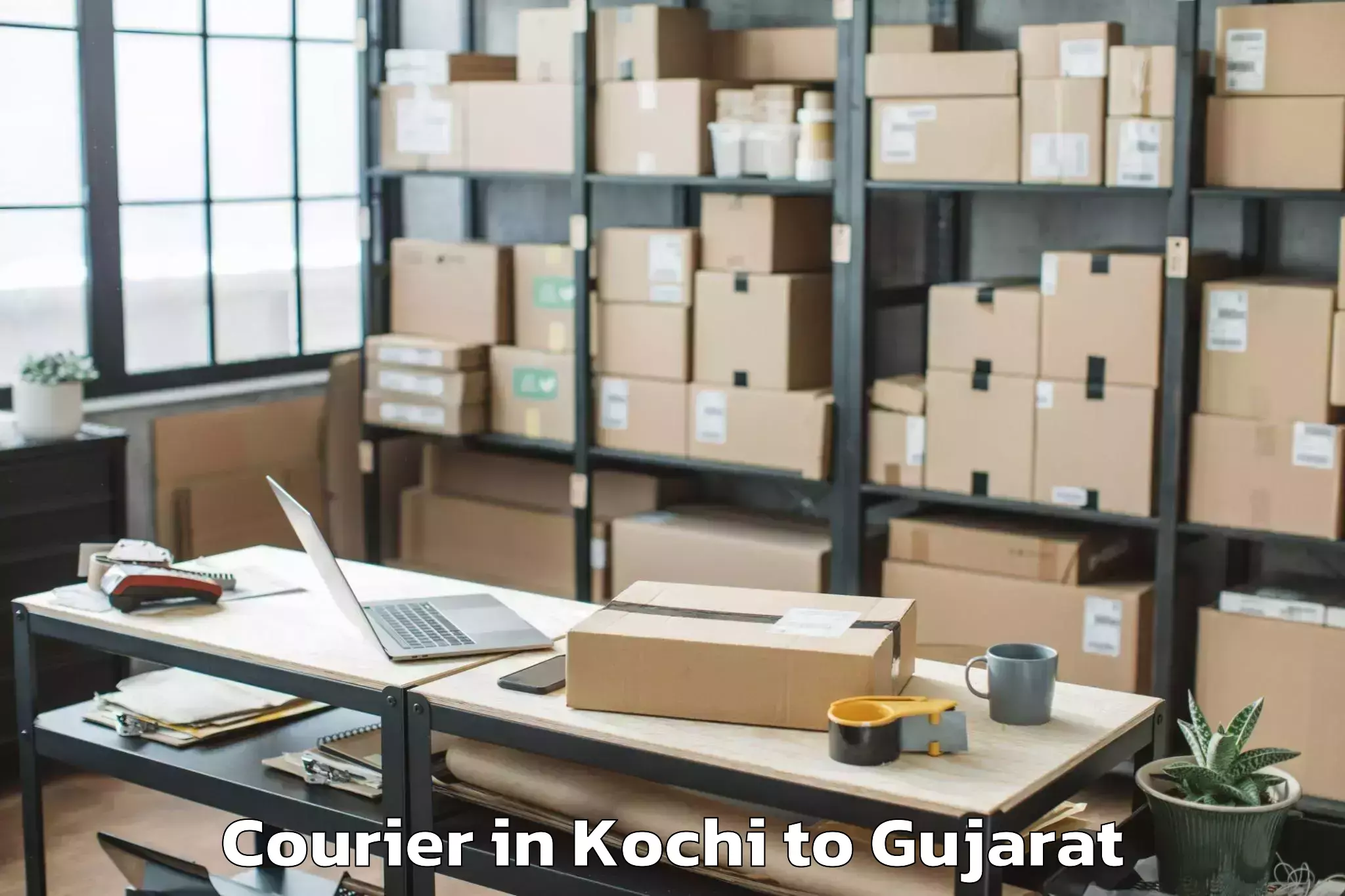 Book Your Kochi to Udhana Courier Today